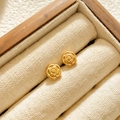 Close-up of elegant gold rose stud earrings nestled in a premium wooden jewelry box - Rose Flower Studs / Gold