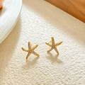 Close-up of gold starfish stud earrings with sparkling pavé cubic zirconia inlay - Gold Starfish Stud Earrings With Zirconia