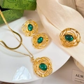 Detail shot of gold jewelry set with emerald green stones on elegant satin fabric - Emerald Look Irregular Texture Set (A523)
