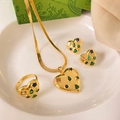 Detail of heart jewelry set with multicolored stones and gold-plated chain on ceramic tray - Multicolor Gemstone Vintage Heart Set (A526)