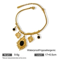 Macro detail of gold-plated stainless steel bracelet with black gems and geometric pendants - Black Main Stone Geometric Pendant Style (X1161)