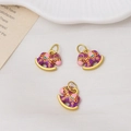 Detailed close-up of three purple enamel rocking horse charms with golden metal alloy bases - Single Piece / Purple