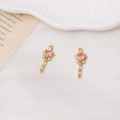 Detailed view of gold plated angel wand charms with pink heart stones and crystal wings - 02# Pink