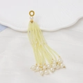 Detail of cream seed bead tassels with golden ring and large round pearl accents - Light Yellow