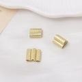 Macro view of gold-plated magnetic tube spacer beads with diamond-cut pattern for DIY jewelry - 4*10mm / 14K Gold