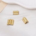 Detailed macro view of gold-plated cylindrical beads with textured diamond-cut surface - 3.5*10mm / 18K Gold