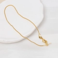 Detail of adjustable golden box chain with slider bead and needle end for jewelry making - 18K Gold
