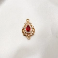 Detail of vintage gold water drop pendant with red stone and micro-set zircon - Red
