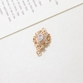 Golden flower rhodium plated pendant with teardrop zircon and hollow filigree design - White