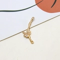 Macro detail of a gold-plated bamboo-style pendant with zircon leaves and dual loop connectors - Bamboo Leaf Style (08#)