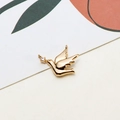 Close-up of bird shaped gold pendant with cubic zirconia and two connection rings - Pigeon Style