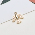 Detailed macro view of gold bird pendant with white cubic zirconia for DIY jewelry - Peace Dove Shape