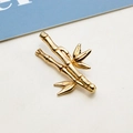 Macro detail of a polished gold bamboo branch pendant for DIY jewelry making - Realistic Bamboo Branch with 3 Leaves Pendant (02#)
