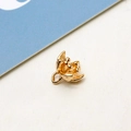Detailed macro view of a golden vintage flower pendant with intricate petals and jump ring - 3D Small Flower with Stamen (06#)