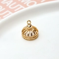 Macro shot of a golden crown pendant with intricate filigree details for DIY jewelry - Crown 01 Style