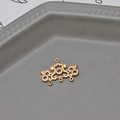 Macro shot of gold vintage filigree pendant with multi-hole design for DIY jewelry - Symmetric Retro Hollow Style (02#)