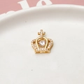Detailed macro view of a gold-plated crown pendant with shimmering dancing zircon stone - Dancing Stone Cross Crown (01#)