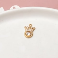 Detailed close-up of a gold-plated crown pendant with white zircon inlays on a tray - Round Ball Zirconia Crown (04#)