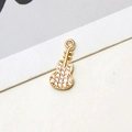 Detailed close-up of gold guitar pendant with micro-set zircons for jewelry crafting - White Guitar Style