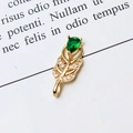 Macro view of gold feather pendant with pear-shaped green gem and micro-set cubic zirconia - 02# Green