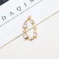 Detailed close-up of a pear-shaped gold-plated copper pendant with zircon inlays - Style 03 (03#)