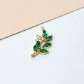 Macro view of gold-plated leaf and flower pendant with green and white zircon stones - Minimum 100 Pieces Price / Green