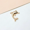 Macro detail of a dolphin jewelry pendant with micro-set zircons and a green gemstone eye - Dolphin Style (05#)