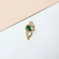 Macro detail of a gold dolphin pendant with emerald green stone and zircon micro-paving - Dolphin Style (04# Green)