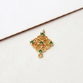 Macro shot of gold-plated hollow rhombus pendant with emerald green cubic zirconia stones - 02# Green