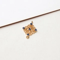 Macro shot of gold-plated hollow rhombus pendant with blue crystals for DIY jewelry - Gift Box Shape Dark Blue