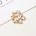 Macro shot of gold floral charm pendant with cubic zirconia petals and leaf detail - 10 Pieces / No.04