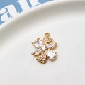 Macro view of gold-plated clover pendant with zircon inlay for jewelry making - No.04
