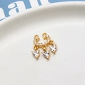 Macro view of gold pendant with micro-paved zircons and three hanging heart stones - 07# Double Loop