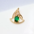 Macro view of gold-plated sailboat pendant with green gemstone and white zircon stones - Green Sailboat Style