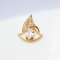 Macro shot of gold-plated sailboat pendant featuring clear zirconia stones on white background - White Sailboat Style