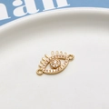 Macro view of gold-plated evil eye connector with micro-paved zircons and lash detail - Style 14 Double Hanging