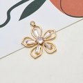 Macro shot of gold floral pendant with baguette cut cubic zirconia on a white card - Flower Style (01#)