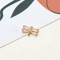 Macro detail of a gold bow-shaped jewelry pendant with inlaid cubic zirconia and dual loops - Bowknot Style (05#)