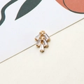 Macro shot of tiered fan-shaped gold pendant with rectangular zircon stones for jewelry - Fan Style (10#)