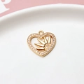 Detailed view of gold plated heart pendant with zircon sunburst and micro pave edge - Sun Radiant Heart Style / Gold