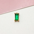 Macro shot of gold-plated emerald-cut green zircon pendant with metallic ring for DIY jewelry - Green