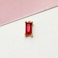 Close-up of gold-plated rectangular red zircon pendant with four-claw setting - Red