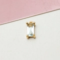 Macro shot of rectangular baguette-cut light blue zircon pendant with gold plated bail - Light Blue