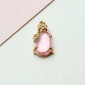 Detailed view of pink crystal teardrop pendant with gold floral frame for DIY jewelry - 8*17MM / Pink