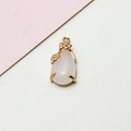 Macro detail of pink crystal teardrop pendant with gold flower frame for DIY jewelry - 8*17MM / Cream