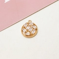 Close-up of gold-plated circular flower pendant with micro-set cubic zirconia crystals - No.04