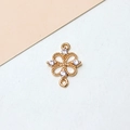 Macro view of gold-plated clover jewelry connector with cubic zirconia and double loops - White