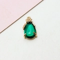 Detailed view of a green teardrop crystal pendant with gold flower accents and metal trim - 8*17MM / Retro Green