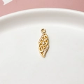 Close-up of gold-plated star wing pendant with cubic zirconia on white ceramic tray - Minimum 10 Pieces Price / Abstract Leaf (04#)