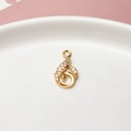 Detail of a swan-shaped gold pendant with sparkling white cubic zirconia inlay - Swan (05#)